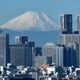 A photo of Mount Fuji in Japan above the Tokyo skyline.